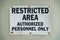 Screwed signage with rust and Restricted Area Authorized Personnel Only- Miami, Florida