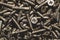 Screws background. heap of tapping screws. pile of fasteners