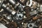 Screws background. heap of tapping screws. work tool. pile of fasteners. bolts and nuts. metal scrape