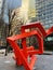 Scribbleform is a red sculpture by Julian Wild on the streets of Canary Wharf London