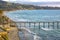 Scripps pier, beach and coastline near the end of the day at golden hour