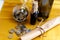 Scroll of paper with wine bootle and glass with coins on yellow background