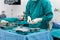 Scrub nurse prepare medical equipments for surgery