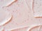 Scrub smears. Pink exfoliating body polish texture