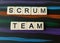 Scrum team word in letters on dark colorful background