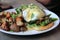 Scrumptious breakfast of poached eggs and home fries