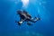 Scuba diver enjoying the beauty of the underwater world, surrounded by crystal clear waters