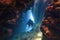 Scuba diver inside the underwater cave in beautiful natural light