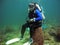 Scuba diver on sea toilet, Thailand