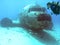 Scuba Diver Surveys a DC-3 in Majuro Lagoon, Marshall Islands