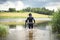 A scuba diver in a wet suit prepares