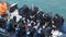 Scuba divers in a boat returning fom a sea diving trip.