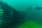 SCUBA divers exploring a mysterious sunken helicopter