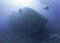 Scuba divers exploring a shipwreck