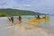 Scuba Divers walking on beach after a dive trip