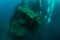 Scuba divers in wreck. Scuba diving in caribbean sea