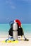 Scuba tank with Santa hat on tropical beach