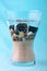 Scuba watch in a vase with sand and pebbles