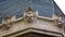 Sculpted cherub heads on the top of a building in the grounds of the Church of the Sacred Heart in Paray Le Monial, Burgundy, Fran