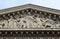 The sculpted tympanum of the `La Madeleine` church, Paris