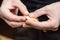 Sculpting dumplings close-up. Women\'s hands make dumplings stuffed with potatoes and mushrooms