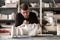 The sculptor conducts restoration work in a plaster workshop. Restoration of the gypsum head of Apollo