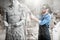 Sculptor grinding sculpture in the studio