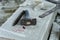 Sculptor tools on a marble slab, close up. Workplace, traditional tools sculptor, red chalk, ruler, hammer and chisel for working