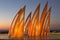 Sculptural group sail with changing colors at sunset in Ashdod,