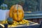 The sculptural head is carved from an orange pumpkin