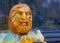 The sculptural head is carved from an orange pumpkin