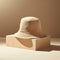 Sculptural Precision: Beige Bucket Hat On Beige Surface