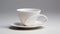 Sculptural Precision: White Tea Cup And Saucer On Gray Background