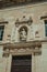 Sculpture above the entrance door on church facade carved in marble