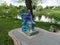 Sculpture of the ancient Greek god Poseidon on the pond bank in the children`s park `Fairy Tale` in Sumy