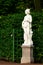 Sculpture of antique european sibyl in summer garden