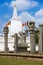 Sculpture of a Buddha on the background of Dagoba Tuparam. Anuradhapura