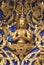 The sculpture of Buddha. The details of The front gable of Wat Phra Kaew in Bangkok, Thailand, Asia