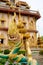 The sculpture of the dragon and the beautiful Chalong temple in the background