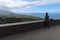 Sculpture of the German naturalist Alexander Von Humboldt sitting on a wall and his famous treatise at the Humboldt viewpoint