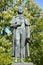 A sculpture by the German poet Friedrich Schiller 1759-1805 against the background of flowering chestnuts. Kaliningrad