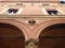 Sculpture heads on a palace facade at Bologna, Italy