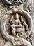 Sculpture of Hindu God sitting on an animal detail. Bas relief sculpture carved in the walls of ancient Kapaleeshwarar temple