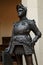 Sculpture of King Arthur old metal statue. Medieval knights armor full size standing warrior. Order of the Knights