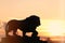 Sculpture of a lion on the Admiralty embankment on a sunset