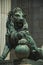 Sculpture lion cast in bronze on building facade in Madrid