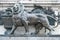 Sculpture of a lion in front of the symbols of the French Revolution and universal suffrage