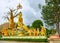 Sculpture of the lord Buddha sitting between men and beasts.