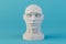 sculpture of a man's head on a blue background. 3D render