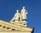 Sculpture of man and women on the roof of Trade Union Palace in